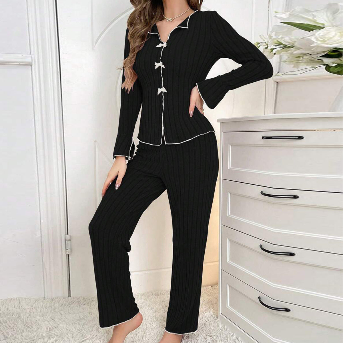 Women's pajama set with fine stripe texture and elegant details