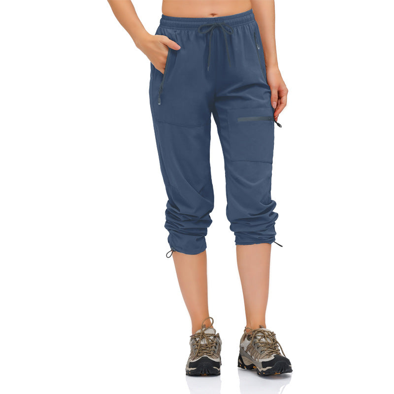 Women's multifunctional sports pants with practical pockets and elastic waistband