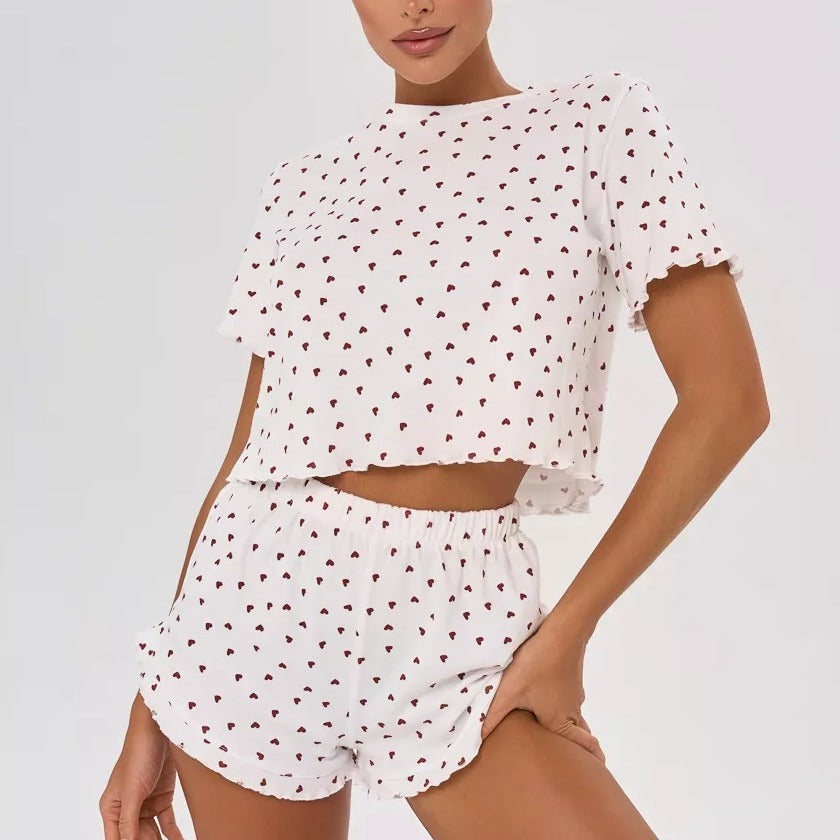 Women's pajamas set with playful heart design and decorative hem