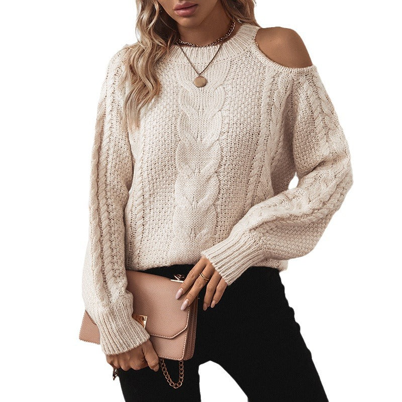 Women's chunky knit pullover with elegant structure and trendy puff sleeves