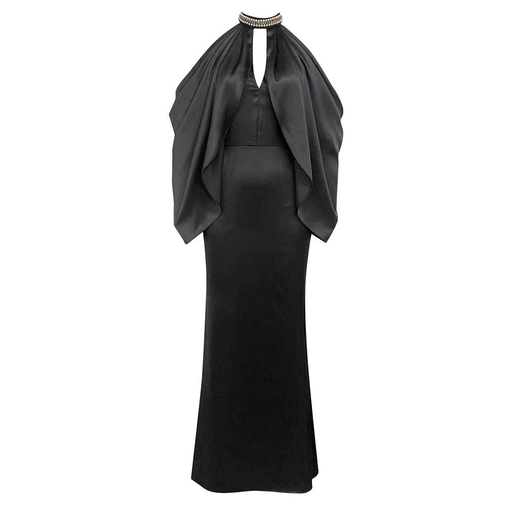 Ladies evening dress with shimmering cape design and elegant closure detail