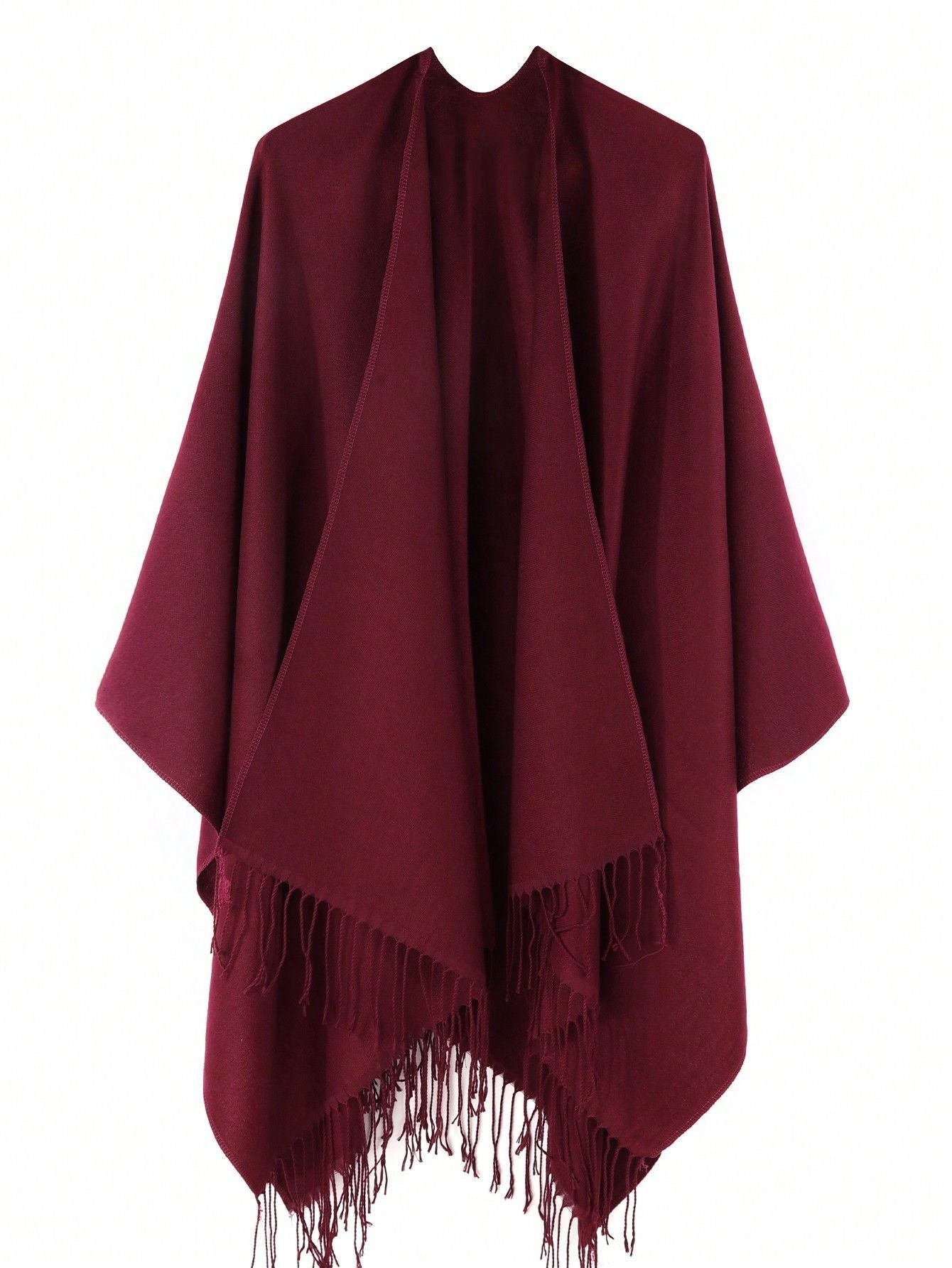 Women's stylish fringe poncho made from soft material with a luxurious drape