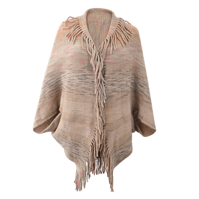 Ladies fashionable poncho with fringed hem and textured design