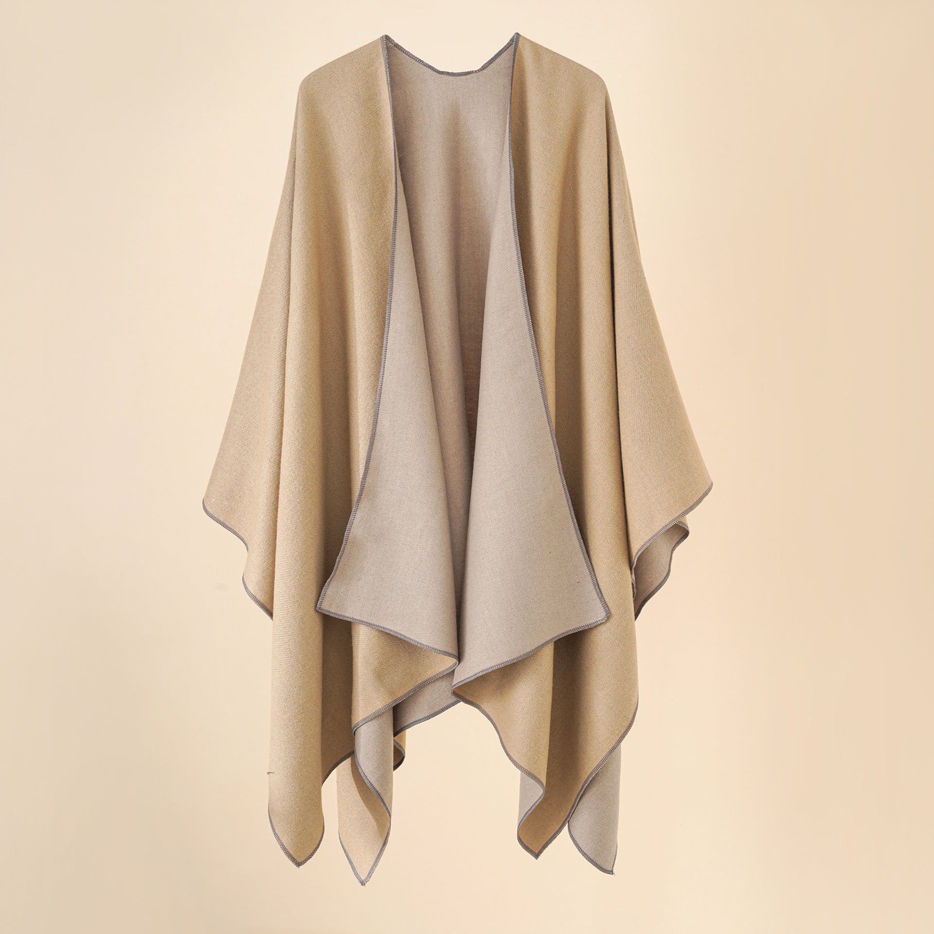 Women’s cozy poncho made of soft wool blend with elegant cut