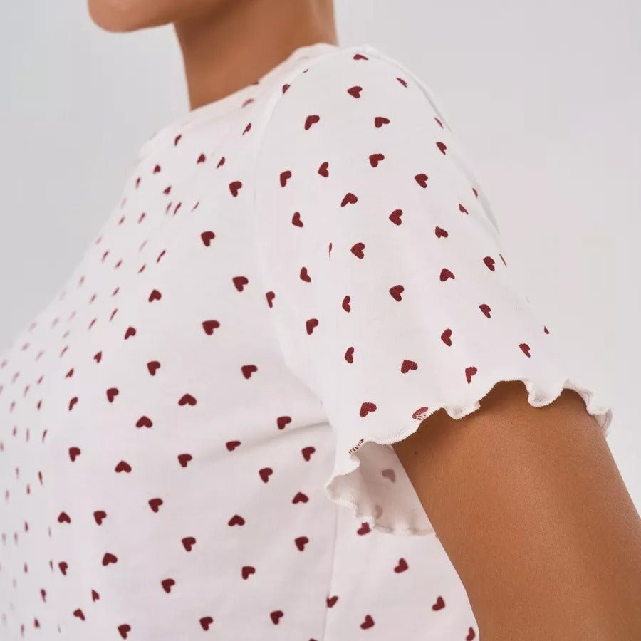 Women's pajamas set with playful heart design and decorative hem