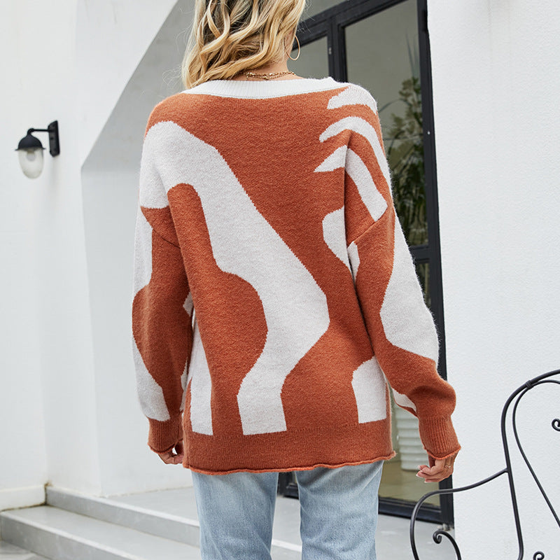 Women's cozy oversized pullover with button details and creative pattern