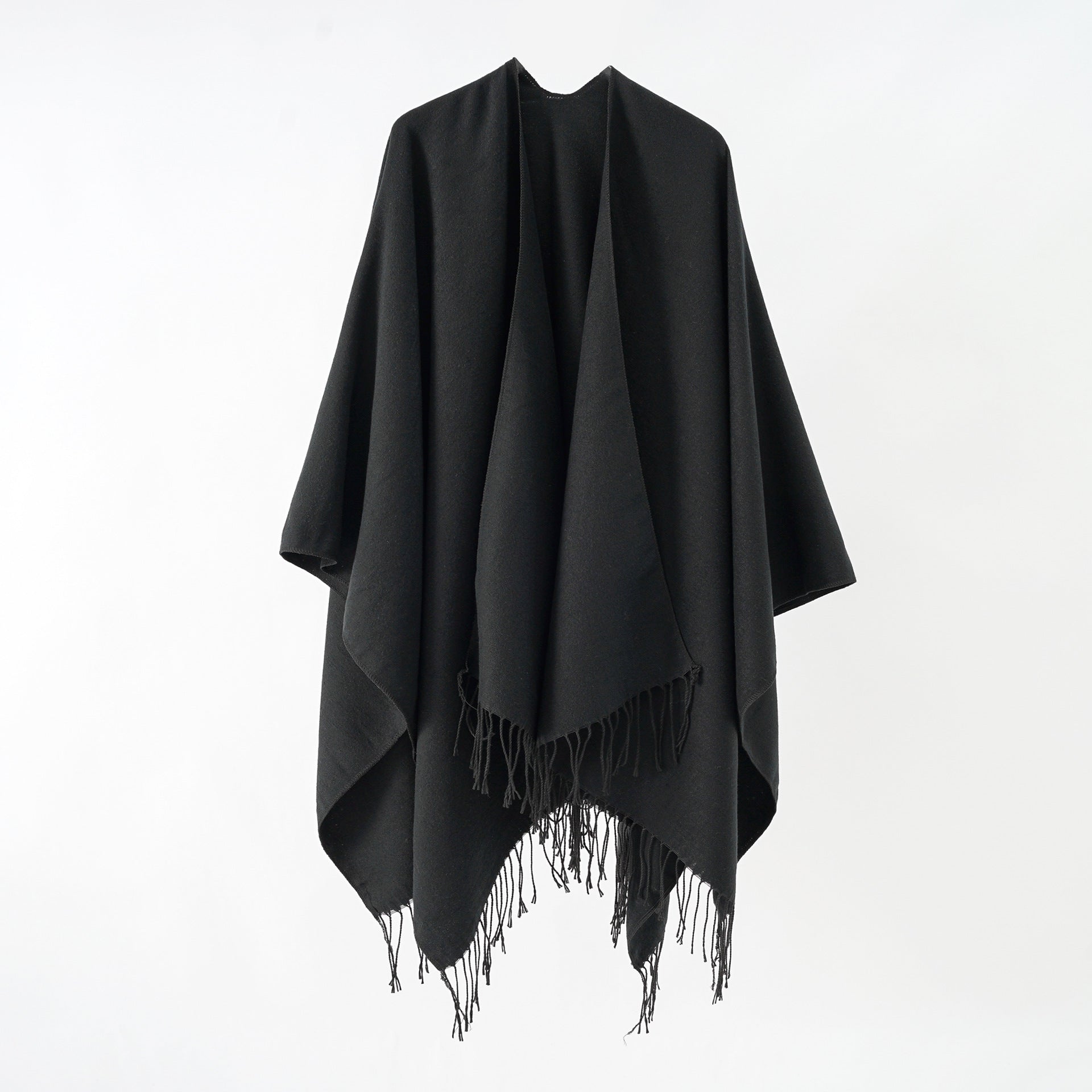 Women's stylish fringe poncho made from soft material with a luxurious drape