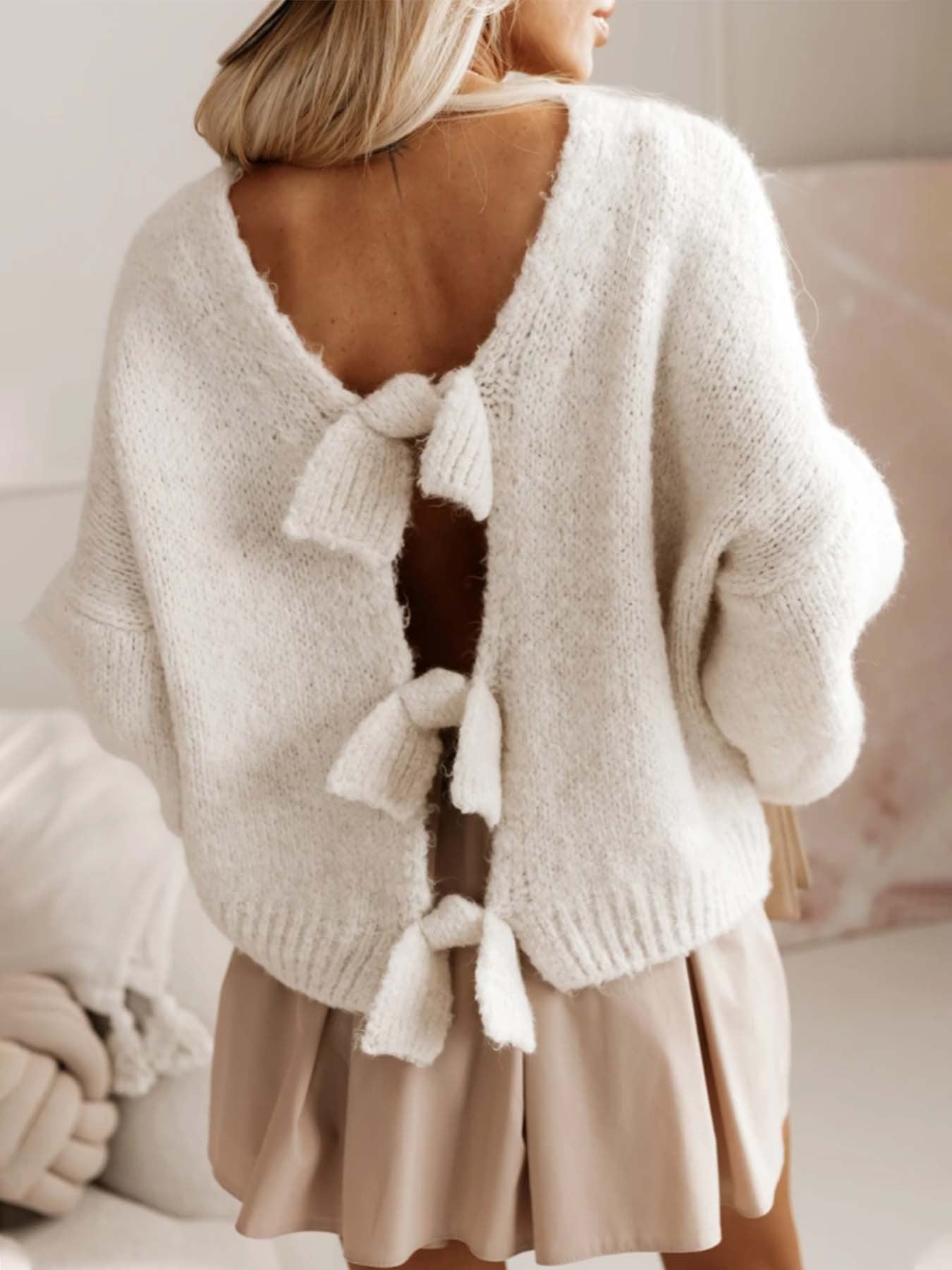Women's casual knitted pullover with deep back cutout and bow details