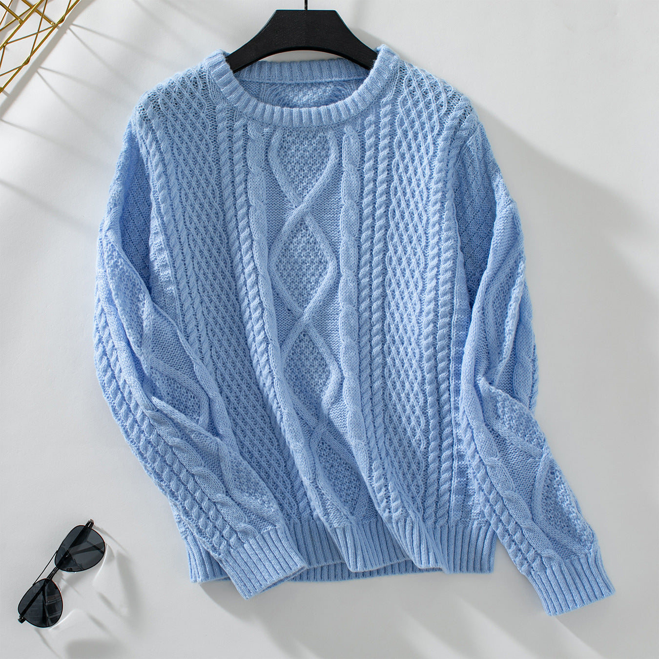 Women's knit pullover with textured cable design and round neck
