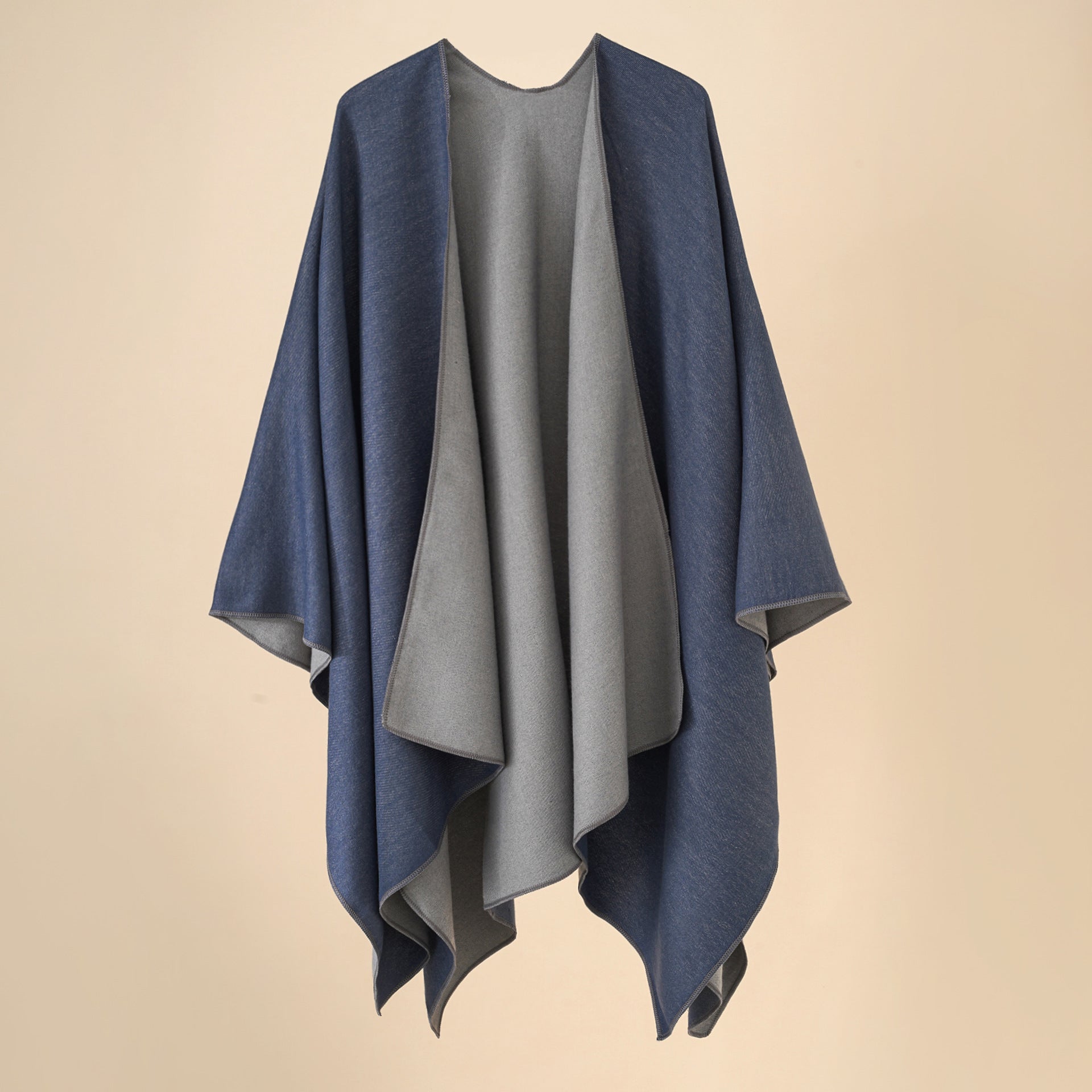 Women’s cozy poncho made of soft wool blend with elegant cut