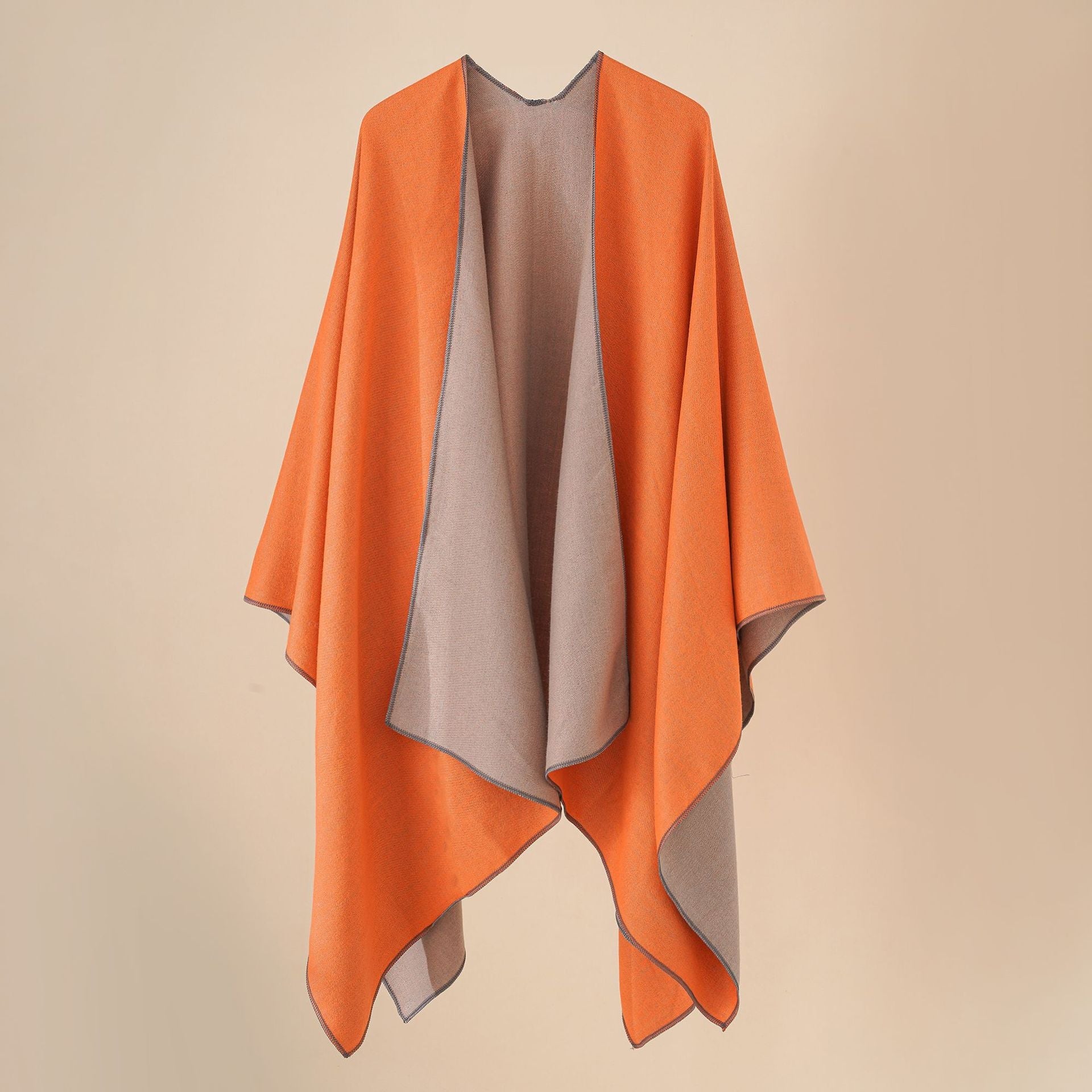 Women’s cozy poncho made of soft wool blend with elegant cut