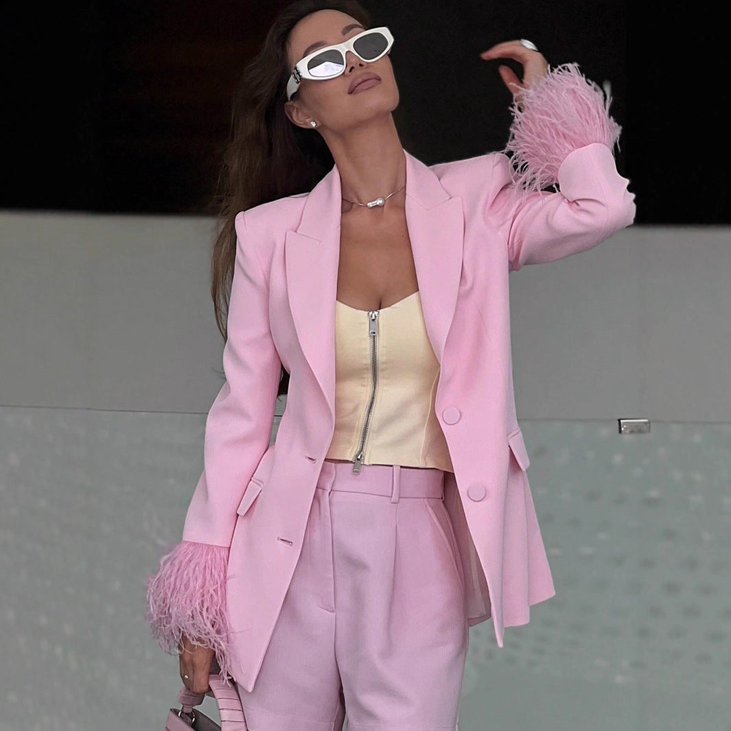 Women's elegant blazer with striking feather sleeves