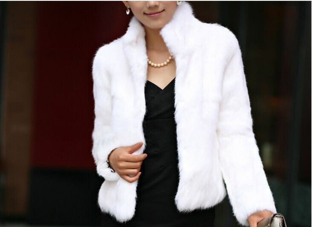 Ladies stylish short jacket made of the softest faux fur with wide lapels