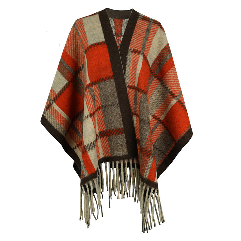 Women's elegant poncho with modern check pattern and fringes