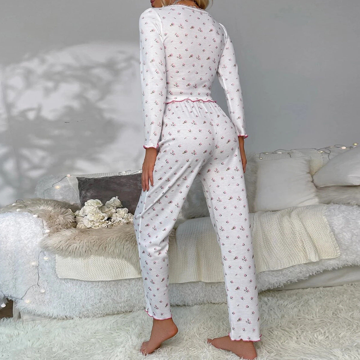 Women's pajama set with floral details and ruffle cutouts