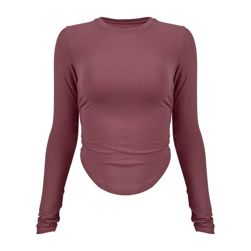Ladies long-sleeved functional top with stylish gathering elements and figure-hugging cut