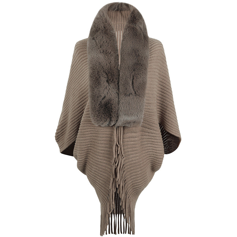 Women's luxurious knit poncho with elegant faux fur collar and fringes