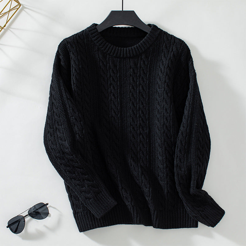 Women's knitted pullover with cable pattern and high cuffs