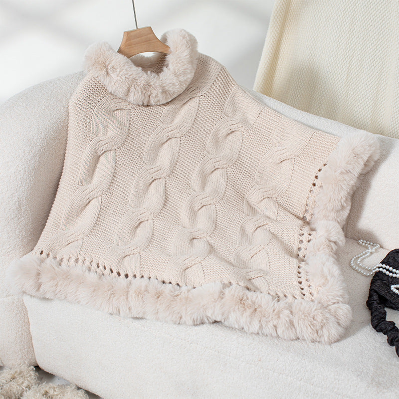 Women's cozy knit poncho with soft faux fur trim and cable knit pattern