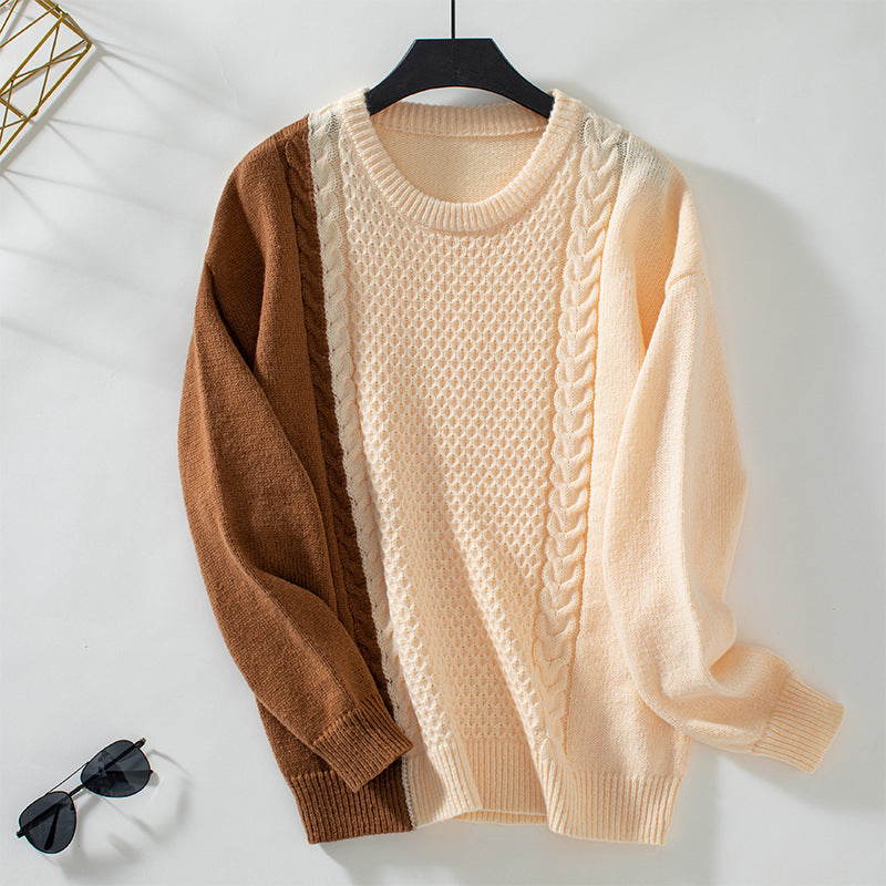 Ladies fashionable pullover with textured cable pattern and innovative color block design
