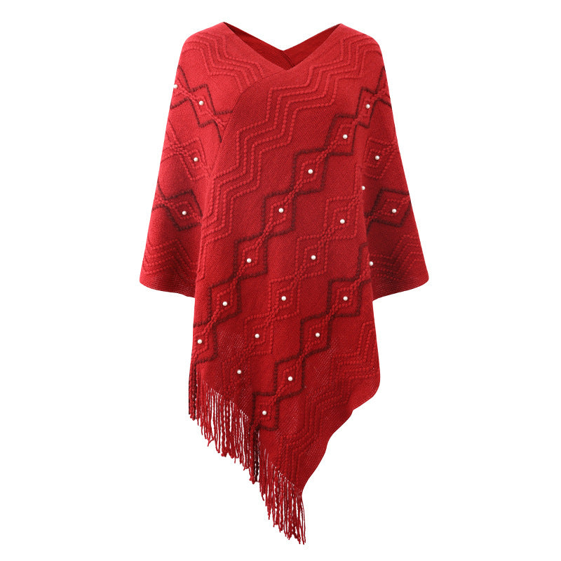 Ladies elegant poncho with eye-catching textured pattern and decorative fringes