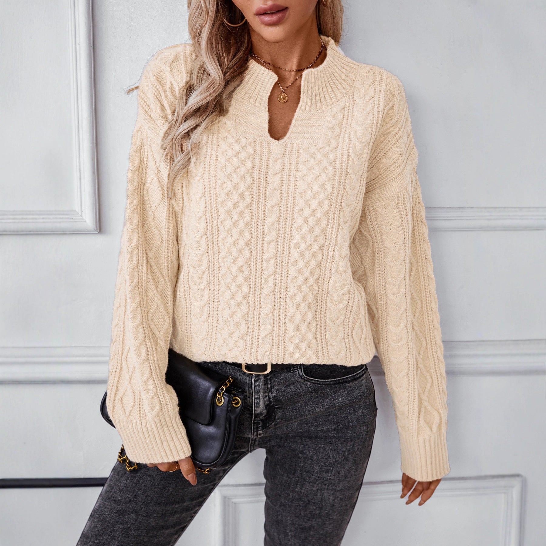Ladies fashionable knit pullover with unique cable design and round neckline
