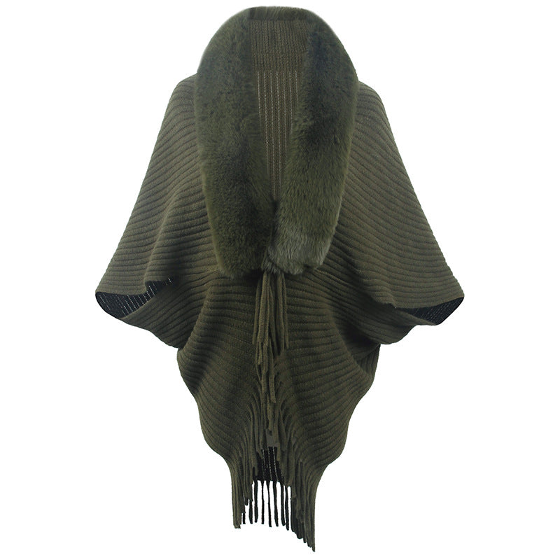 Women's luxurious knit poncho with elegant faux fur collar and fringes