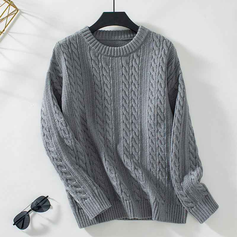 Women's knitted pullover with cable pattern and high cuffs