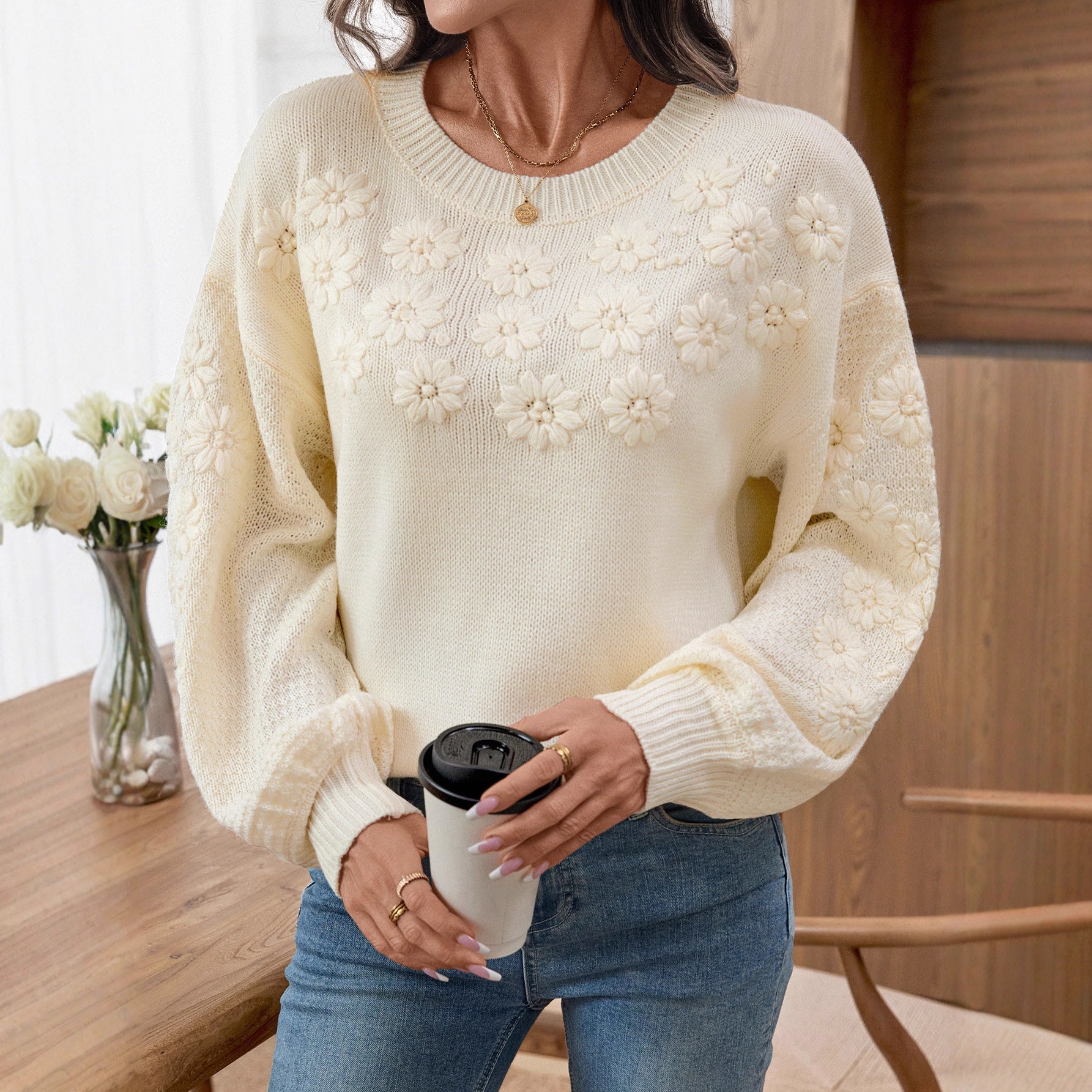 Ladies fashionable pullover with floral embroidery and textured sleeve