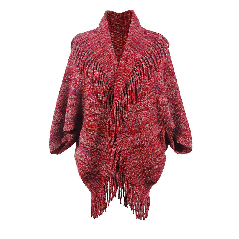 Women's knit poncho with luxurious fringes and modern design