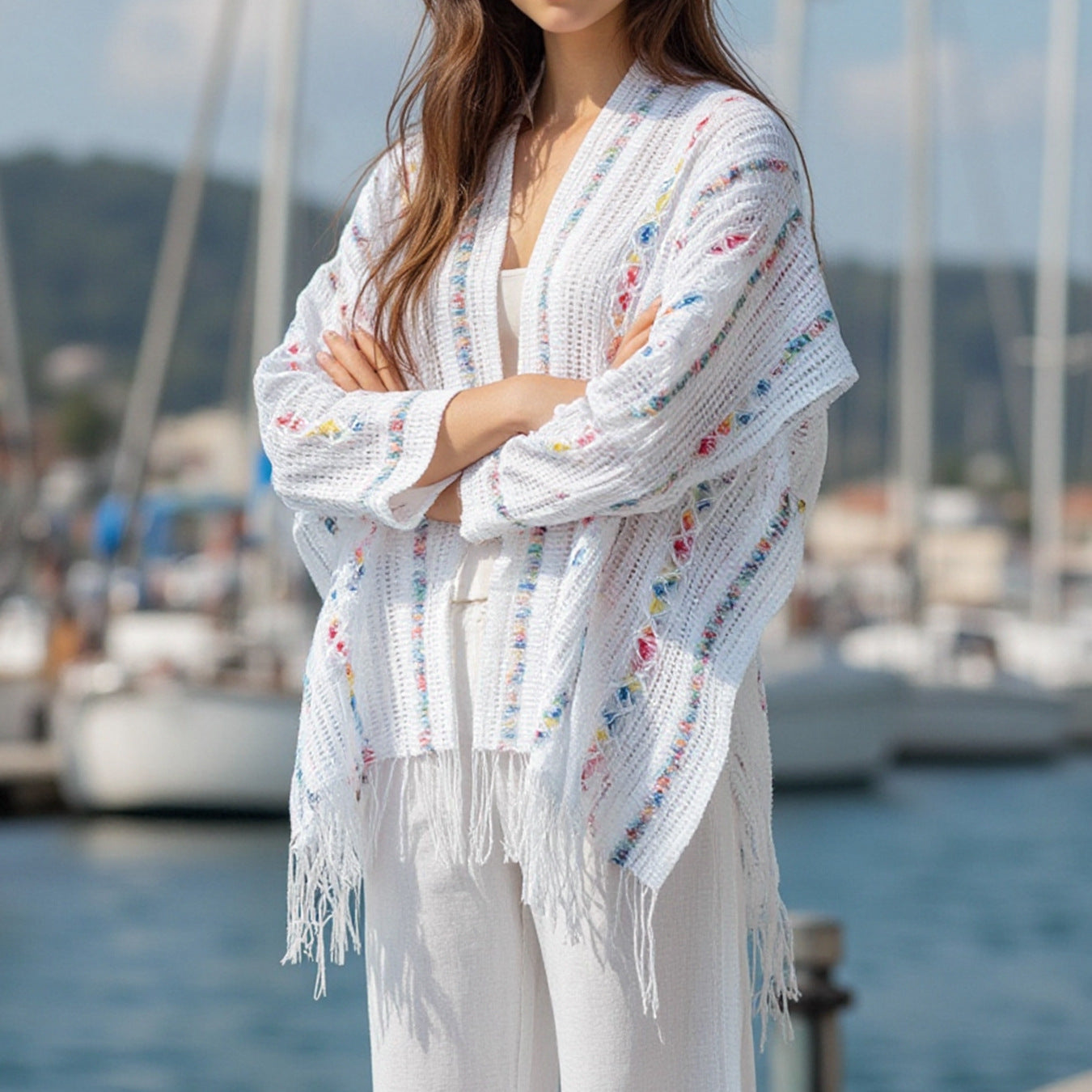 Women’s casual poncho with fringed details and colorful patterns
