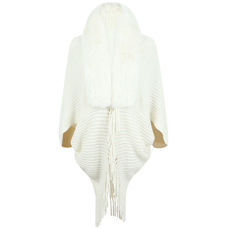 Women's luxurious knit poncho with elegant faux fur collar and fringes