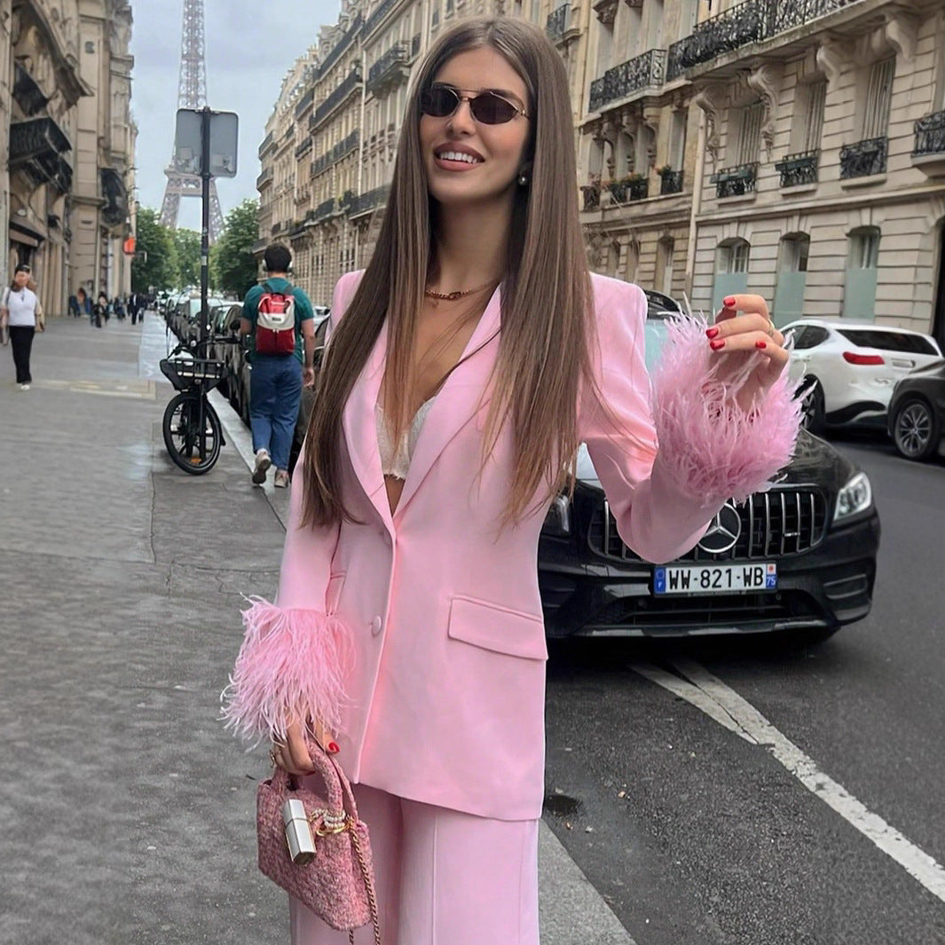Women's elegant blazer with striking feather sleeves