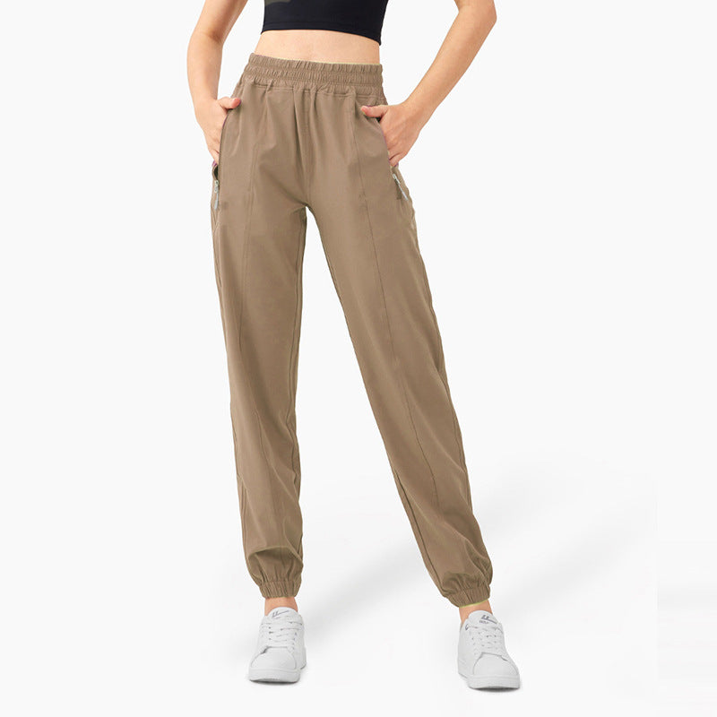 Ladies sporty jogging pants with elastic waistband and side zip pockets