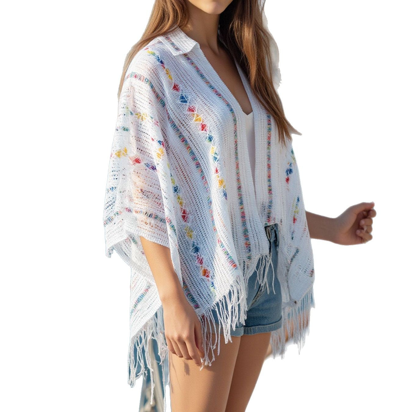 Women’s casual poncho with fringed details and colorful patterns