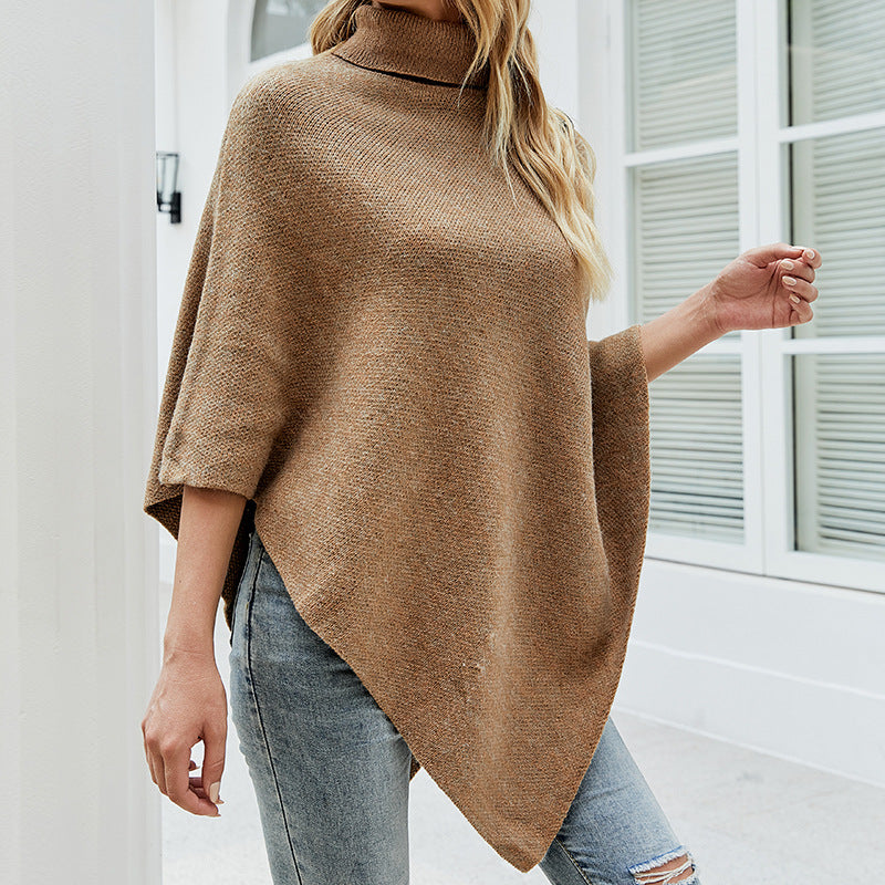 Women's oversized poncho with high collar and decorative button details