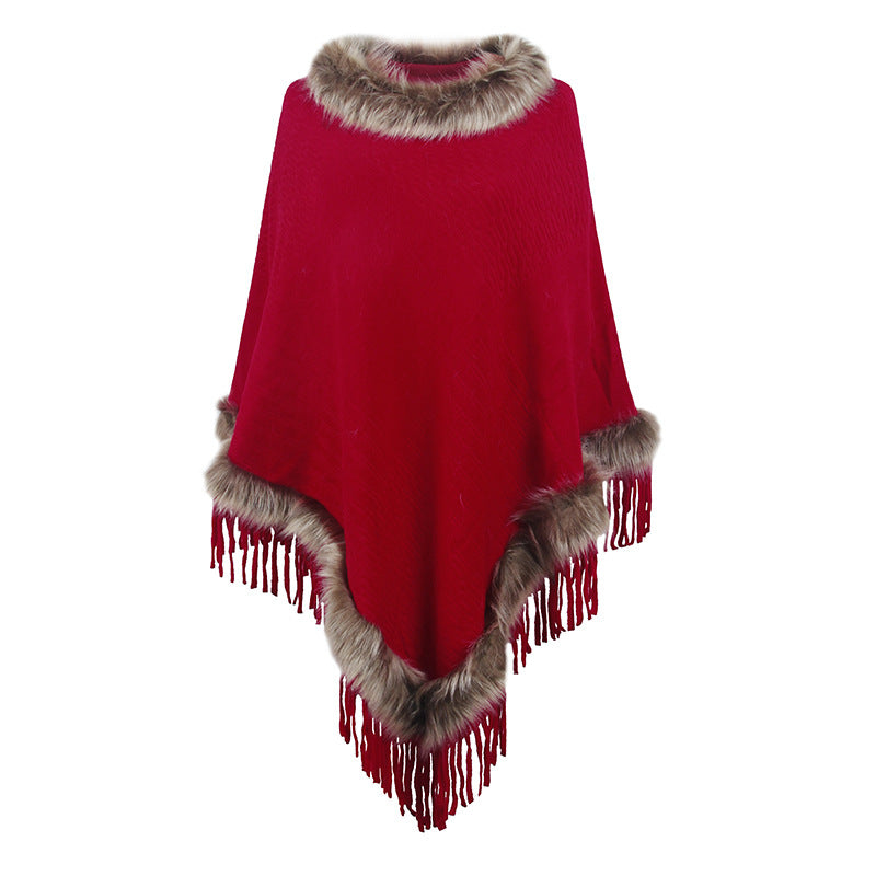 Women's elegant poncho with luxurious faux fur collar and decadent fringes