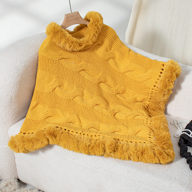 Women's cozy knit poncho with soft faux fur trim and cable knit pattern