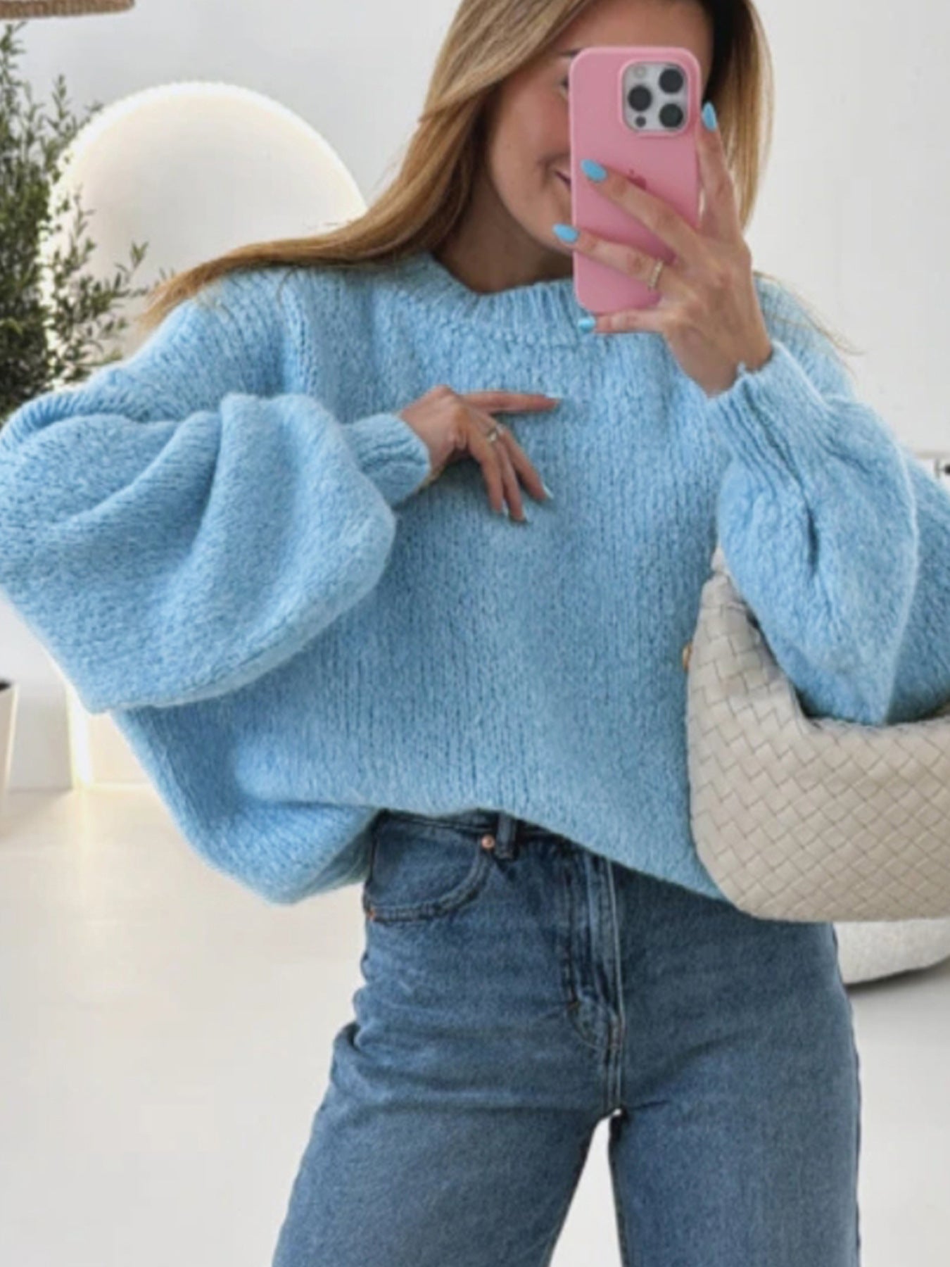 Women's cozy pullover with voluminous sleeves and textured design