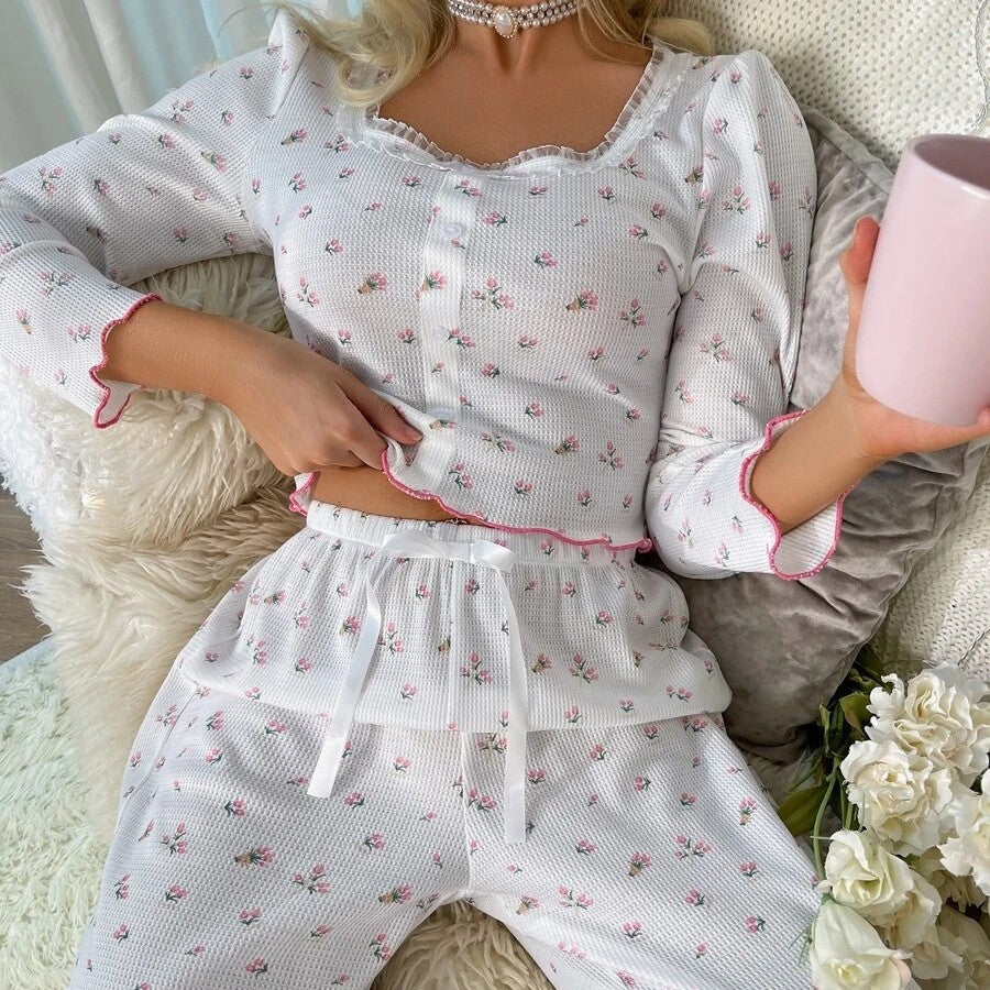 Women's pajama set with floral details and ruffle cutouts