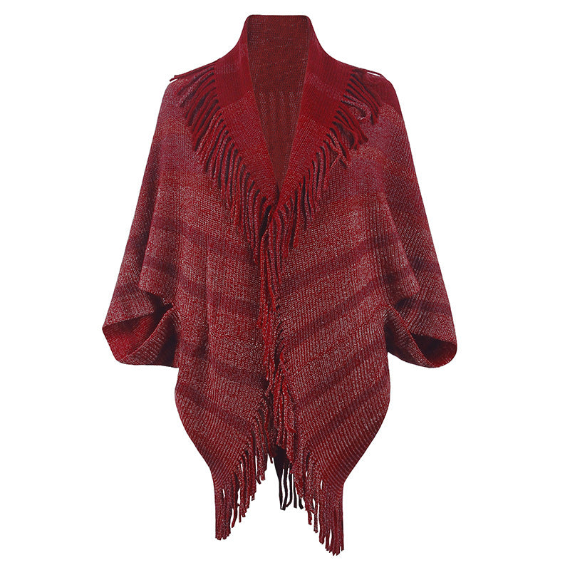 Women’s fashionable knitted poncho with casual fringe design and elegant structure
