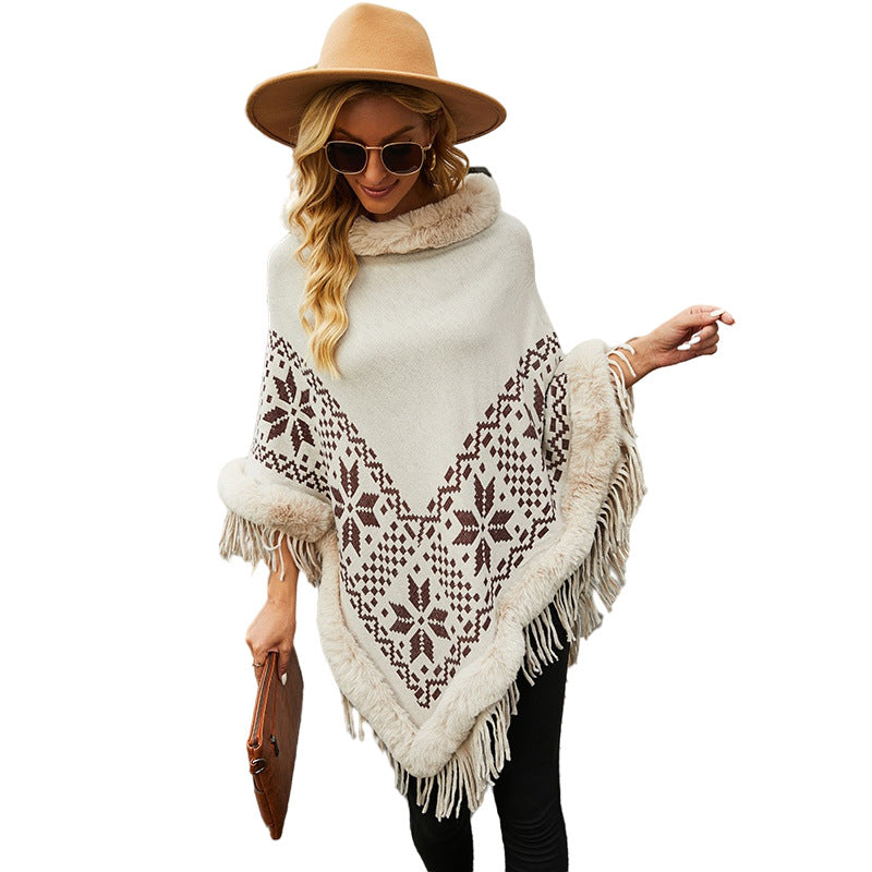 Ladies elegant poncho with decorative fringe design and faux fur trim