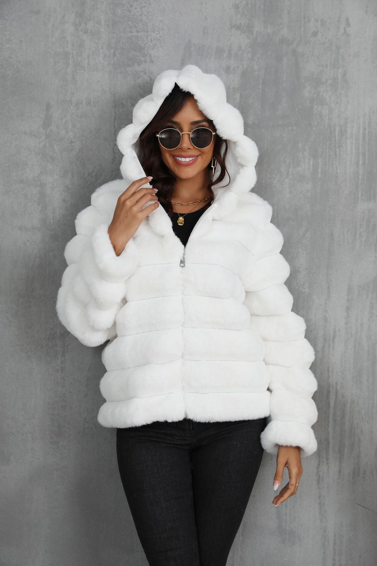 Women's stylish hooded jacket made of faux fur with a textured pattern