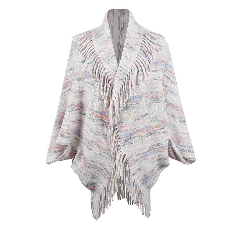 Women's knit poncho with luxurious fringes and modern design