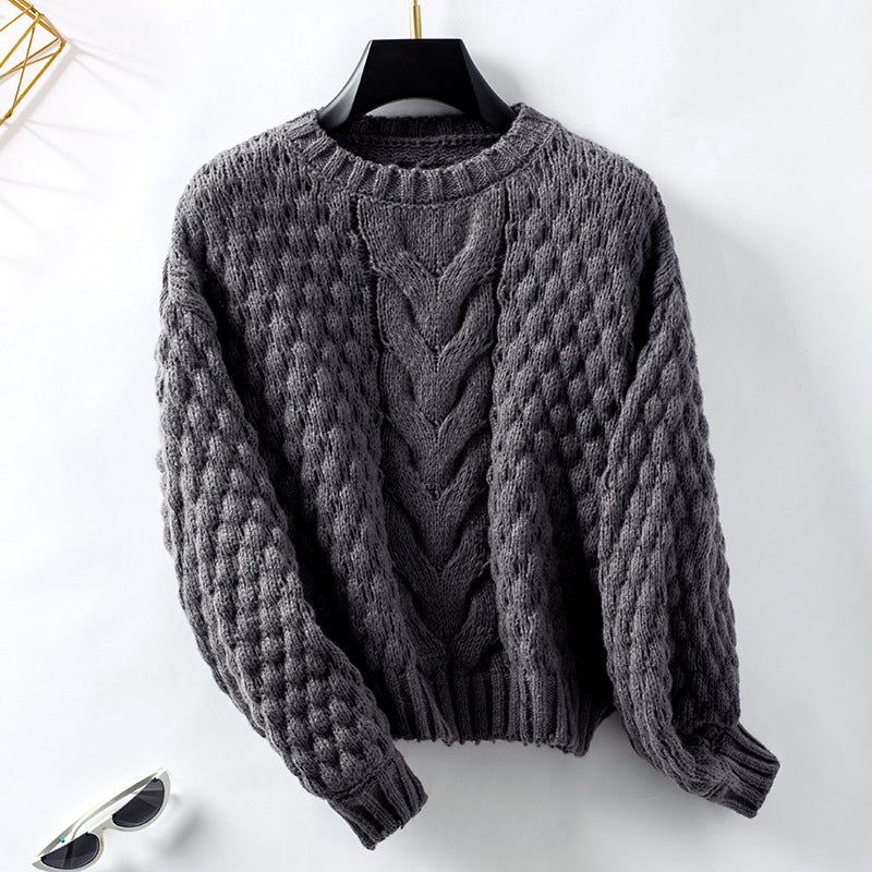 Women's cozy knit pullover with textured cable pattern and casual fit