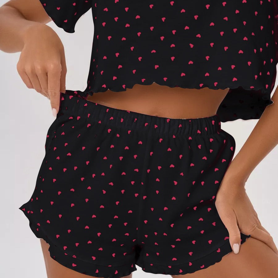Women's pajama set with cheerful heart design and playful hem