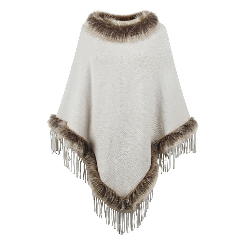 Women's elegant poncho with luxurious faux fur collar and decadent fringes