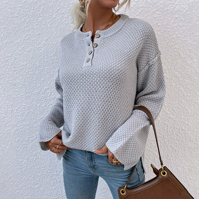 Women's cozy knit pullover with button placket and wide sleeves