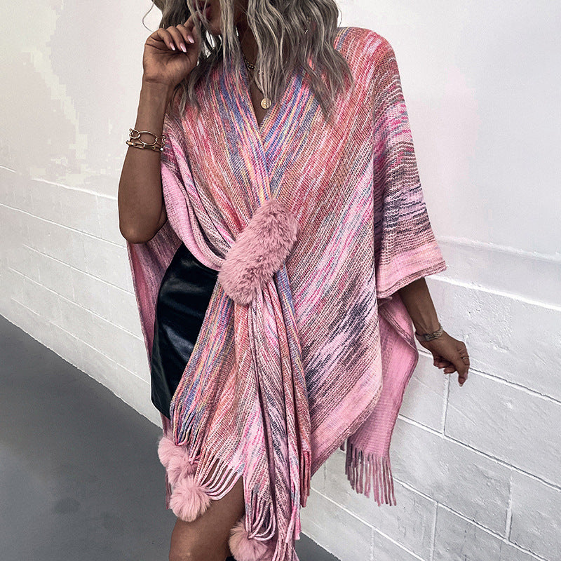 Ladies fashionable poncho with luxurious faux fur trim and creative fringes