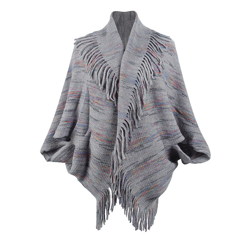 Women's knit poncho with luxurious fringes and modern design